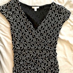 New York & Company black and white polka dot blouse with side ruching.